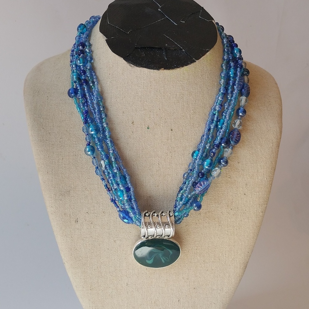 Blue Multi Strand Necklace With Green Pendant
